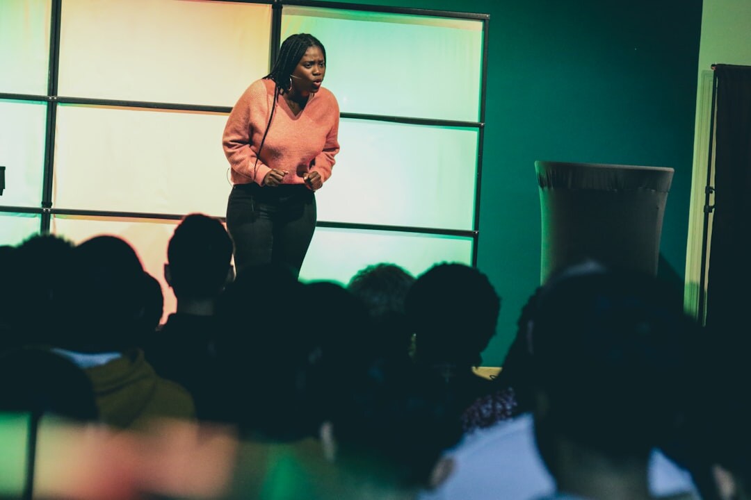 person giving speech on stage