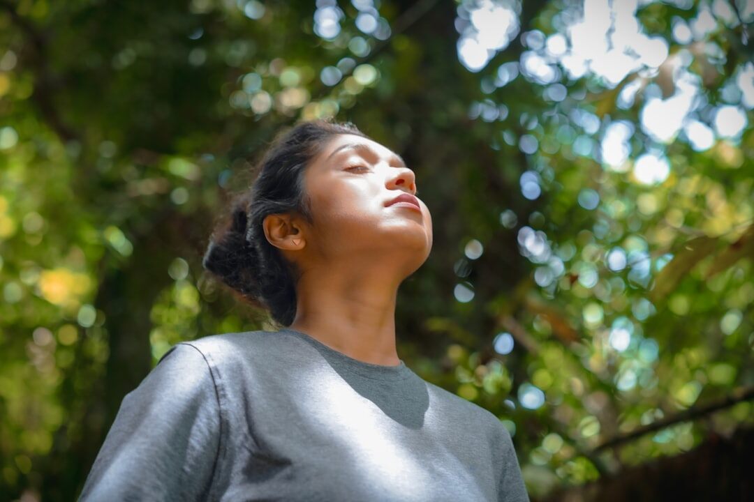 woman practicing breathing exercise
