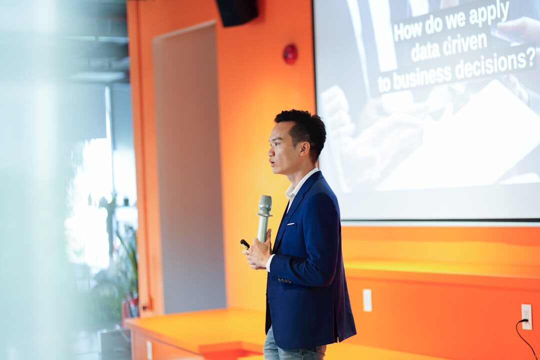 person giving speech on stage