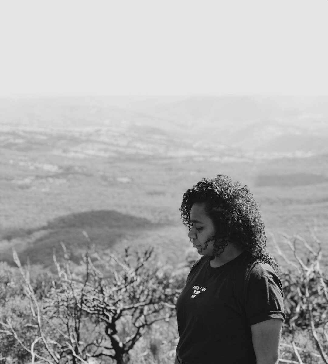Brazilian woman speaking confidently to a small group during a workshop